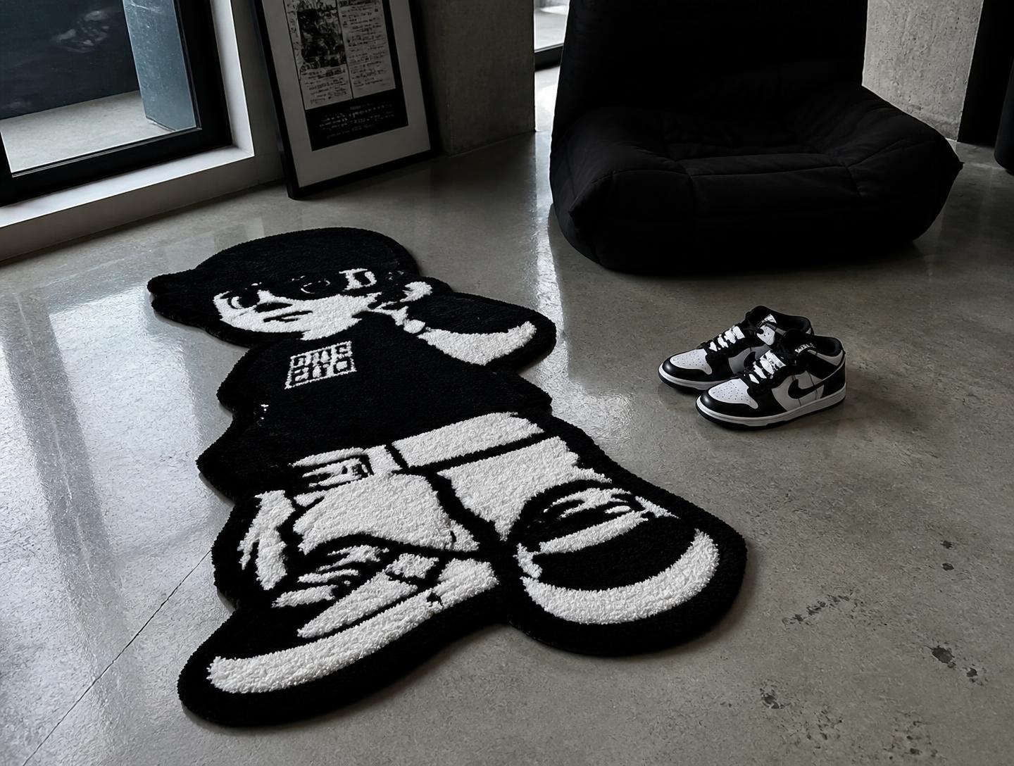 Custom character-shaped tufted rug in a concrete-floored apartment